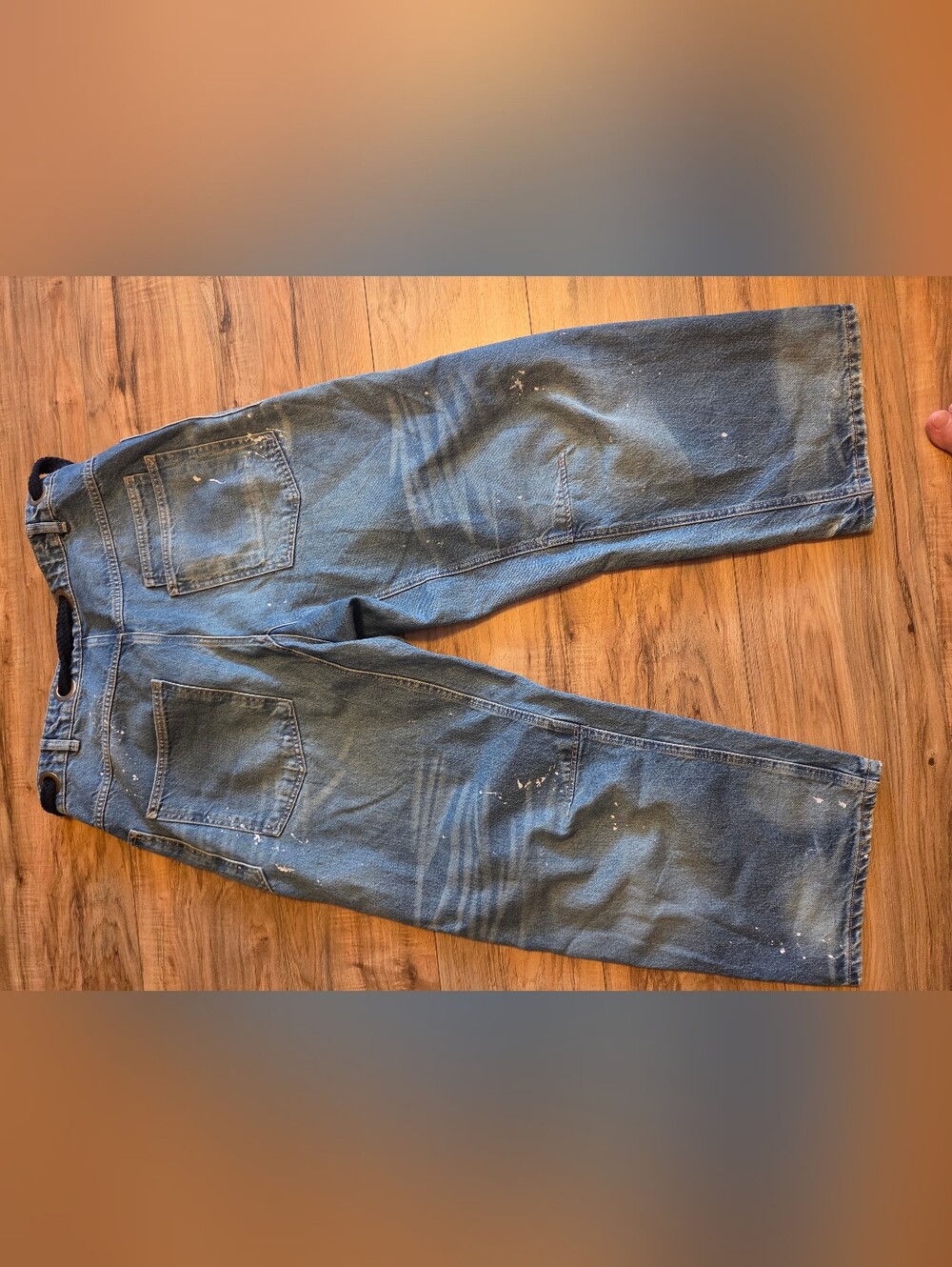 We The Free Men's Relaxed Blue Denim Jeans with White Paint Accents. $148
